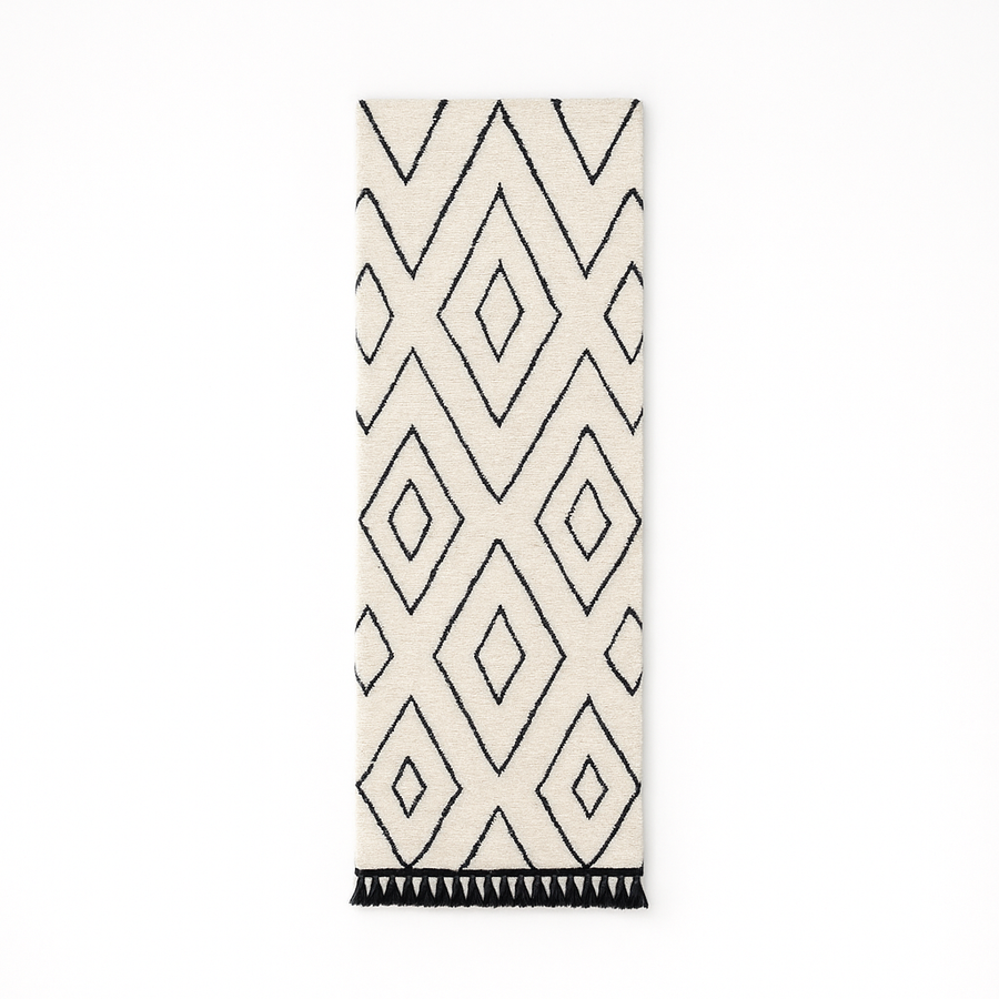Black and white Moroccan runner rug with diamond geometric pattern made of handmade wool and black fringed ends