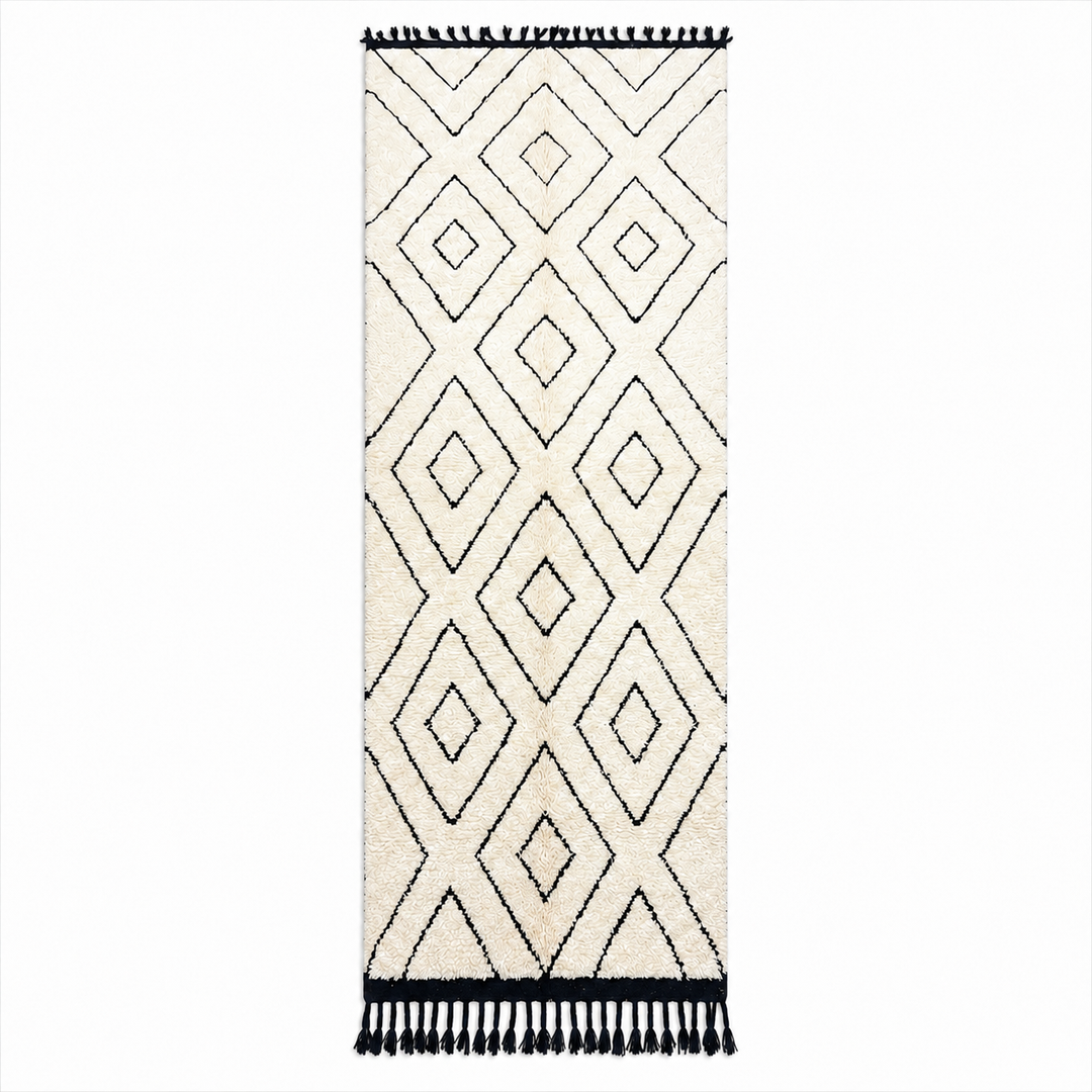 Black and white Moroccan runner rug with diamond geometric pattern made of handmade wool and black fringed ends