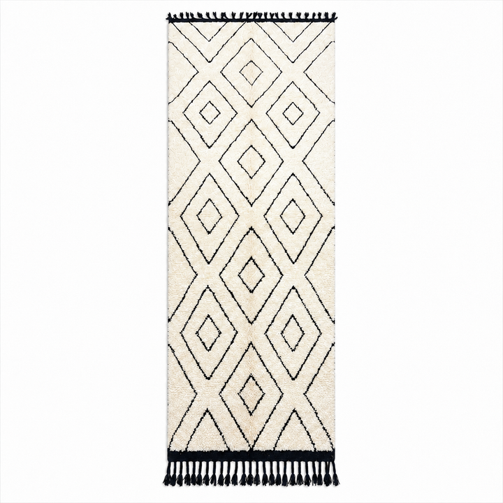 Black and white Moroccan runner rug with diamond geometric pattern made of handmade wool and black fringed ends