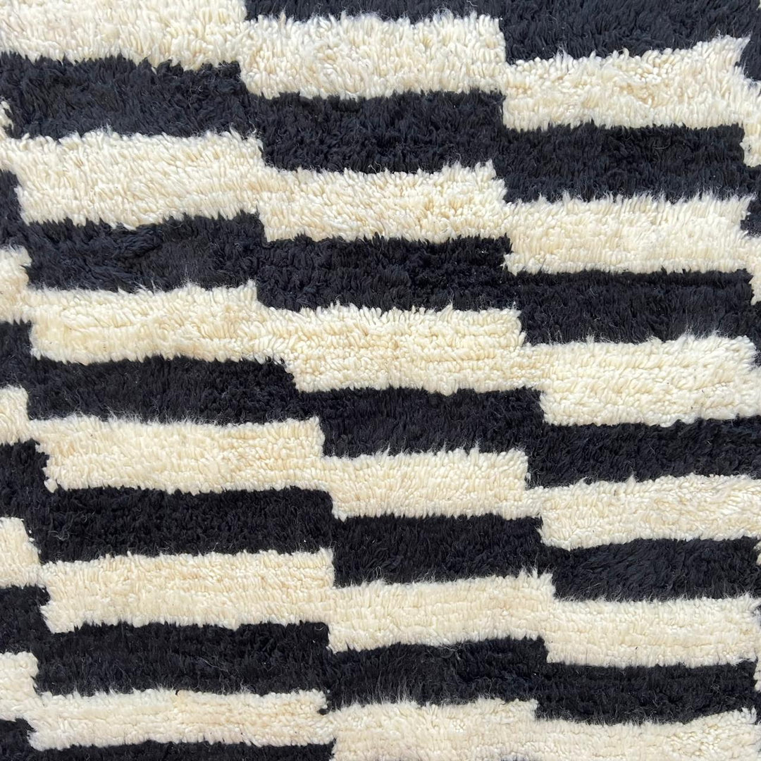 Black and white Moroccan Berber runner rug with geometric wool pattern, handmade hallway runner
