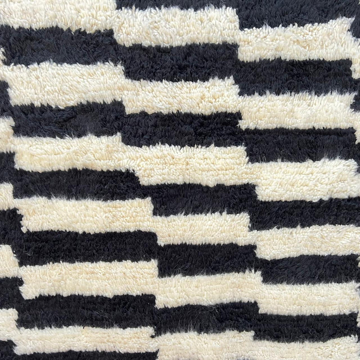 Black and white Moroccan Berber runner rug with geometric wool pattern, handmade hallway runner