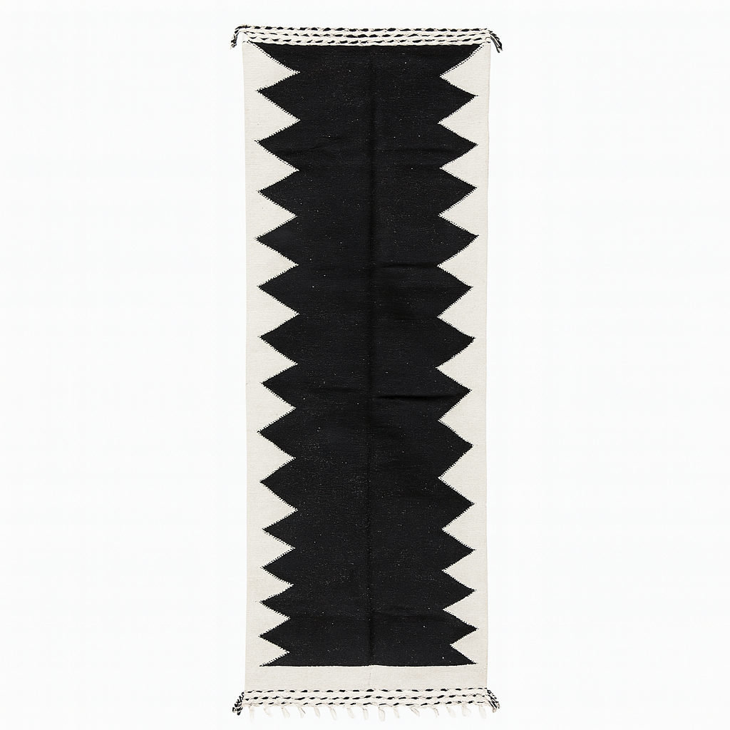 Handmade black and white Moroccan kilim runner rug with bold zigzag geometric design and flatwoven Berber pattern
