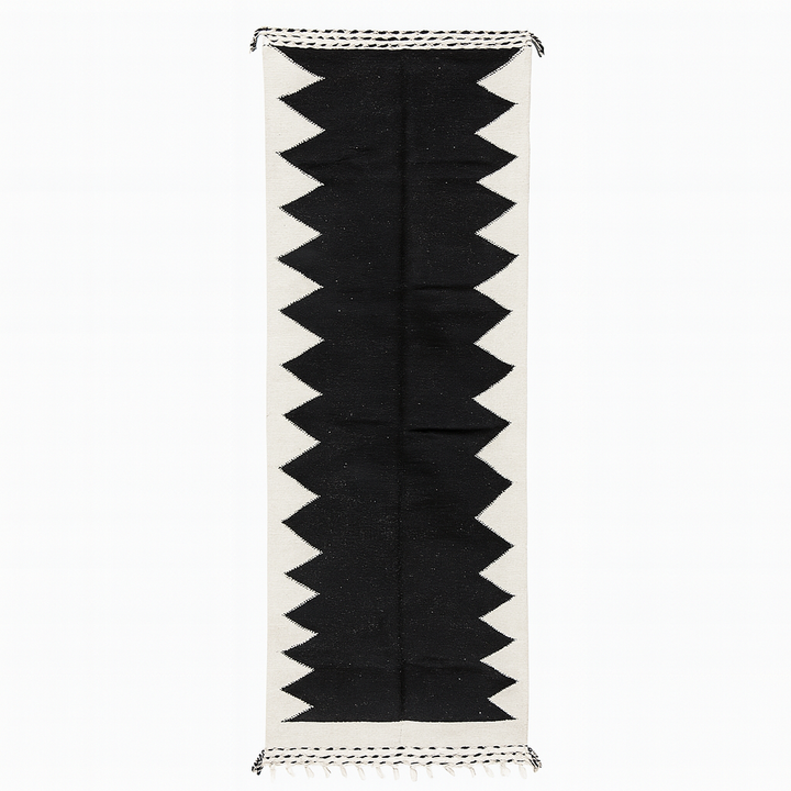 Handmade black and white Moroccan kilim runner rug with bold zigzag geometric design and flatwoven Berber pattern