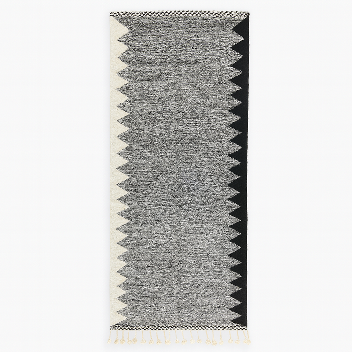 Handmade black and white Moroccan kilim runner rug with bold zigzag geometric pattern and flatwoven wool texture