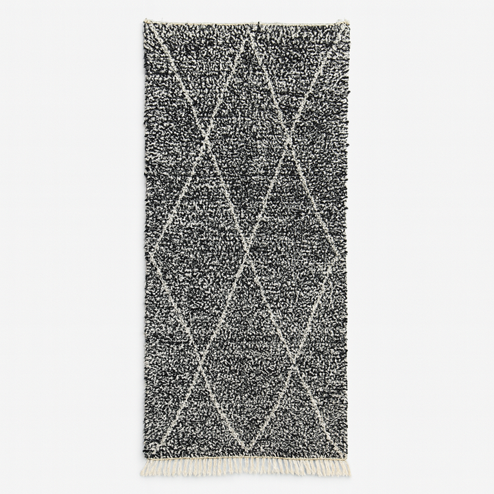 Handmade black and white Moroccan runner rug with diamond lattice pattern in natural wool, Beni Ourain style shag runner.