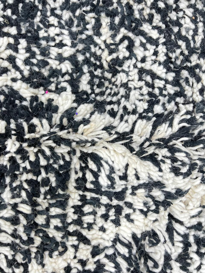 Handmade black and white Moroccan runner rug with diamond lattice pattern in natural wool, Beni Ourain style shag runner.