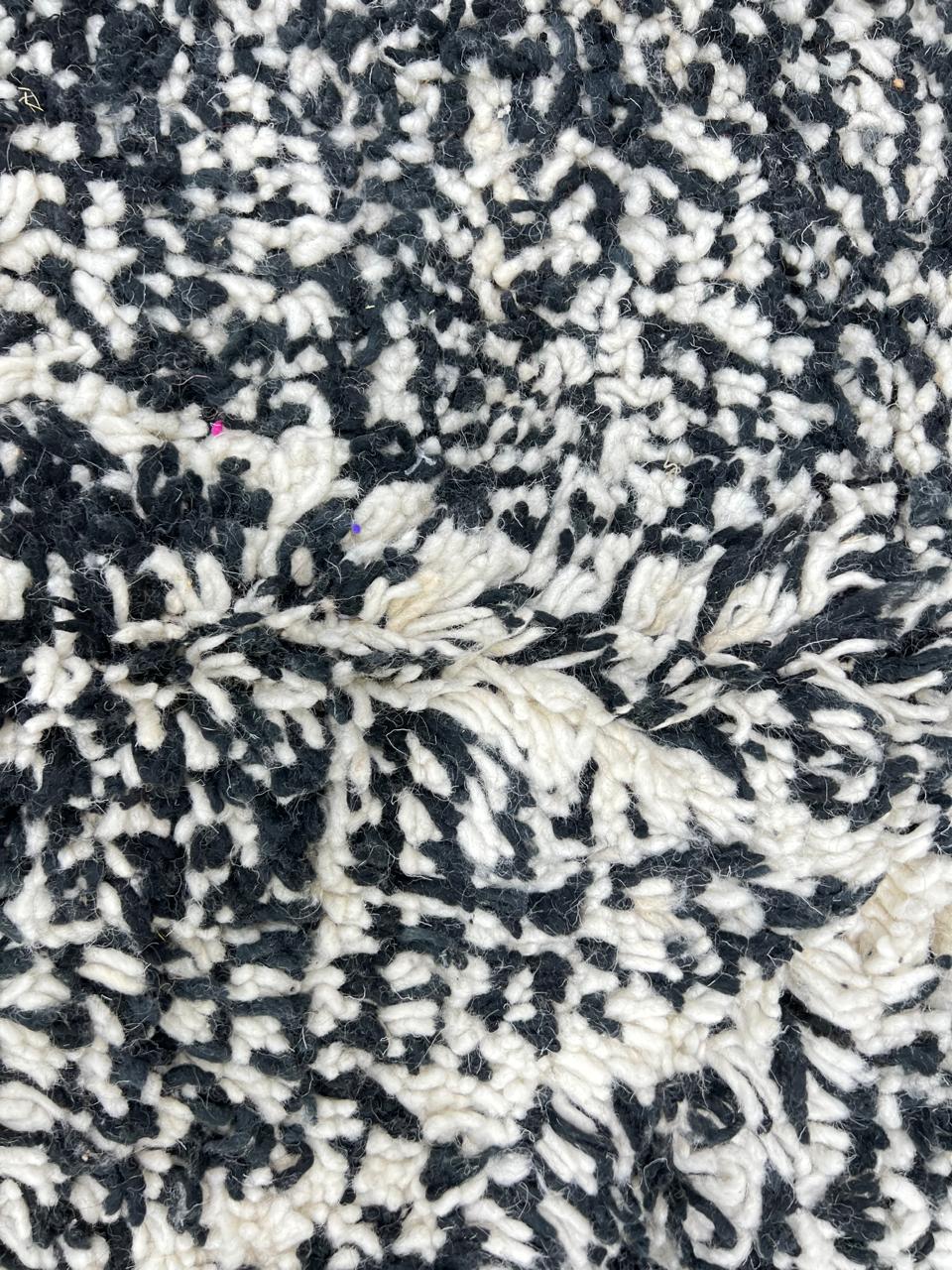 Handmade black and white Moroccan runner rug with diamond lattice pattern in natural wool, Beni Ourain style shag runner.