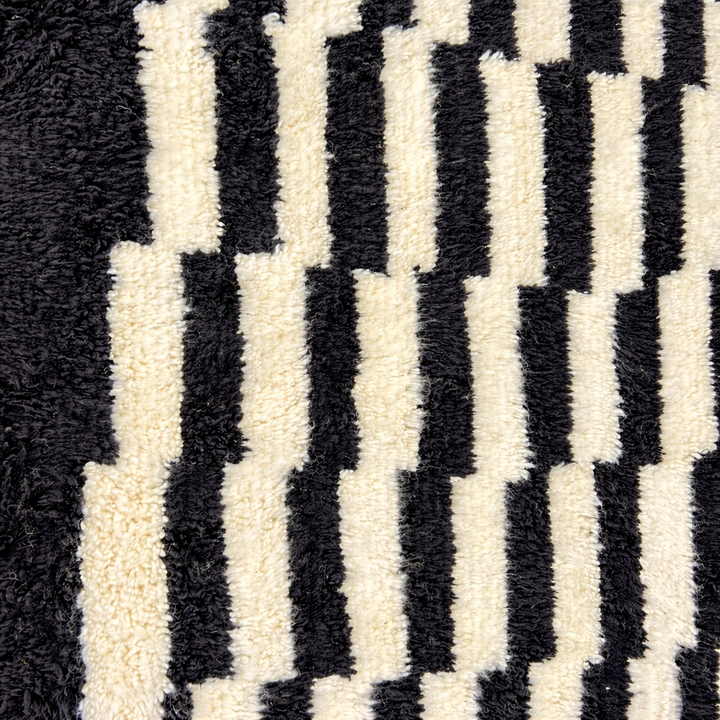 Modern black white Moroccan Berber rug with stepped lines