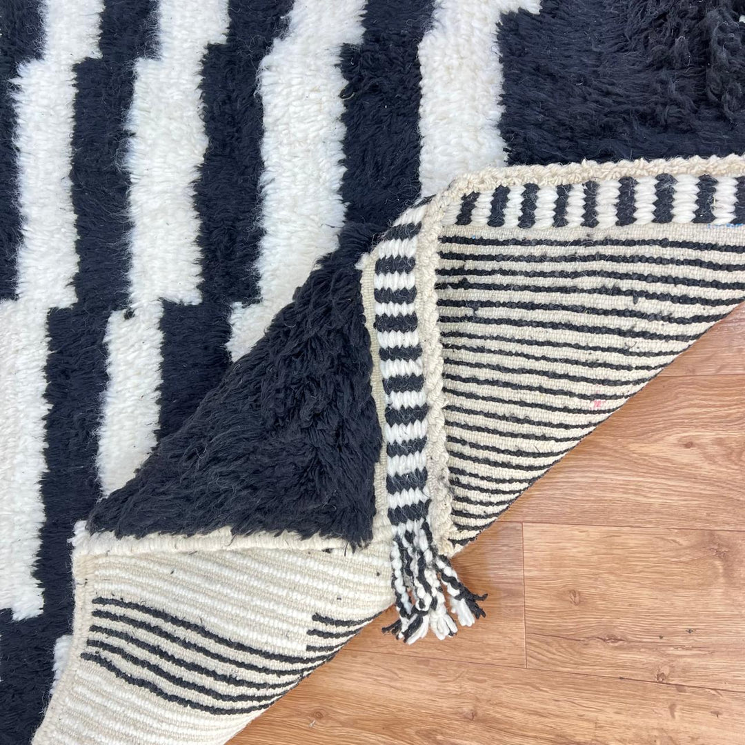 Handmade black and white Berber wool rug with diagonal stepped design