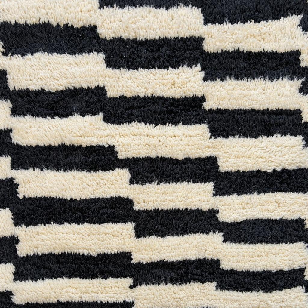 Modern black white Moroccan Berber rug with stepped lines