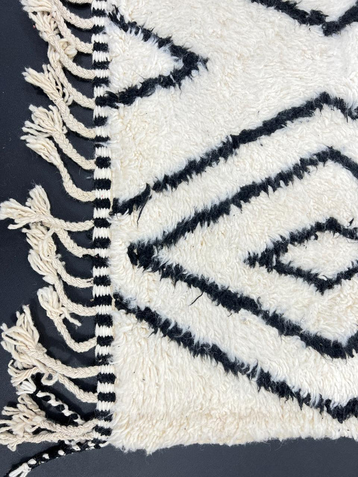 Black and white Beni Ourain Moroccan wool rug with geometric diamond design