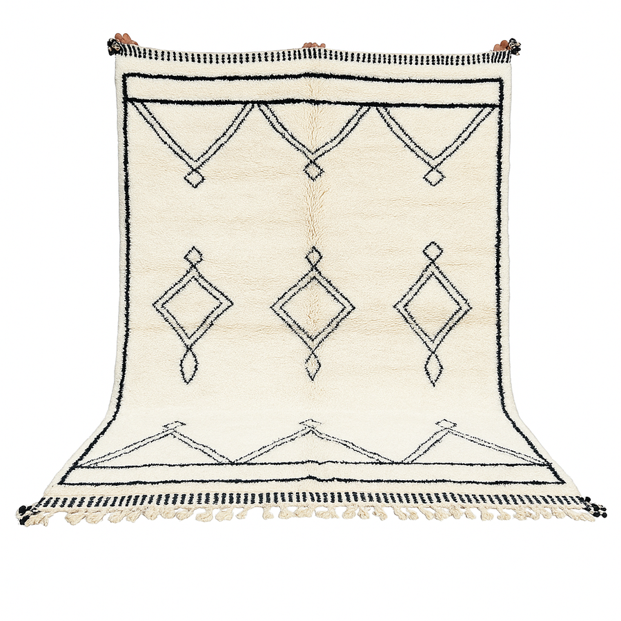 Black and white handmade Beni Ourain Moroccan wool rug with geometric diamond design and fringed edges