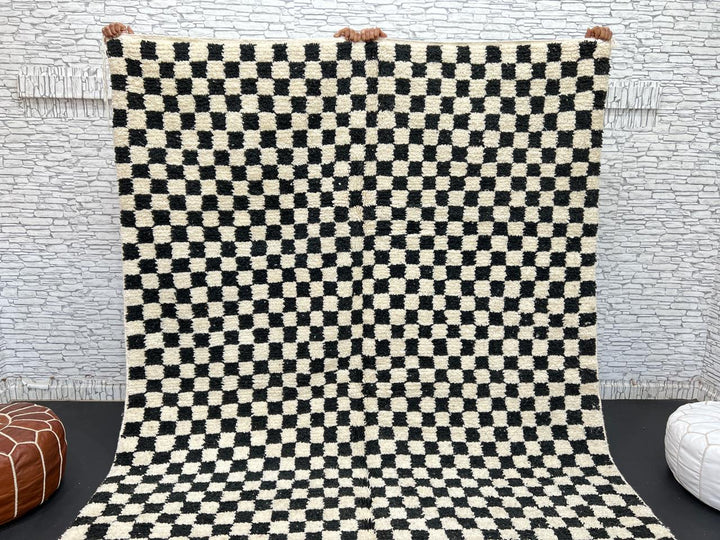 Handwoven black and white Moroccan wool rug with checkerboard pattern