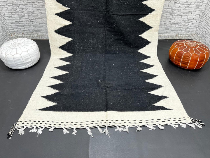 Handwoven Moroccan flatweave rug in black and white – geometric zigzag wool Berber carpet handmade in Morocco