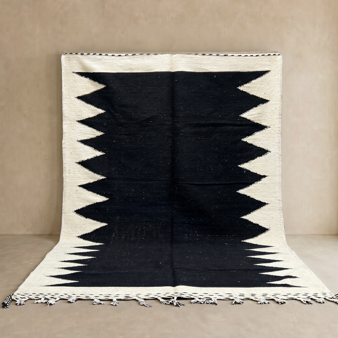 Handwoven Moroccan flatweave rug in black and white – geometric zigzag wool Berber carpet handmade in Morocco
