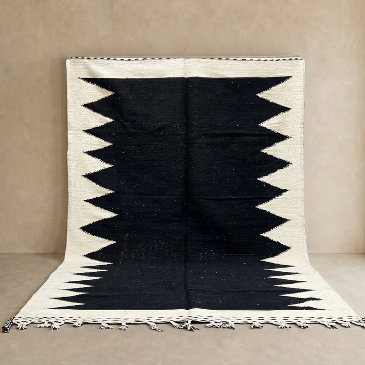 Handwoven Moroccan flatweave rug in black and white – geometric zigzag wool Berber carpet handmade in Morocco
