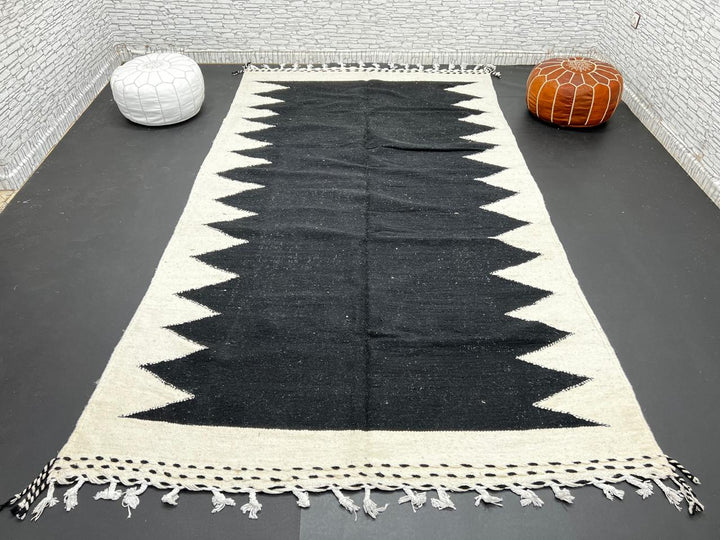 Handwoven Moroccan flatweave rug in black and white – geometric zigzag wool Berber carpet handmade in Morocco