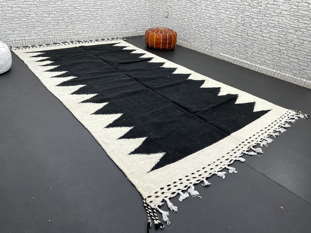 Handwoven Moroccan flatweave rug in black and white – geometric zigzag wool Berber carpet handmade in Morocco
