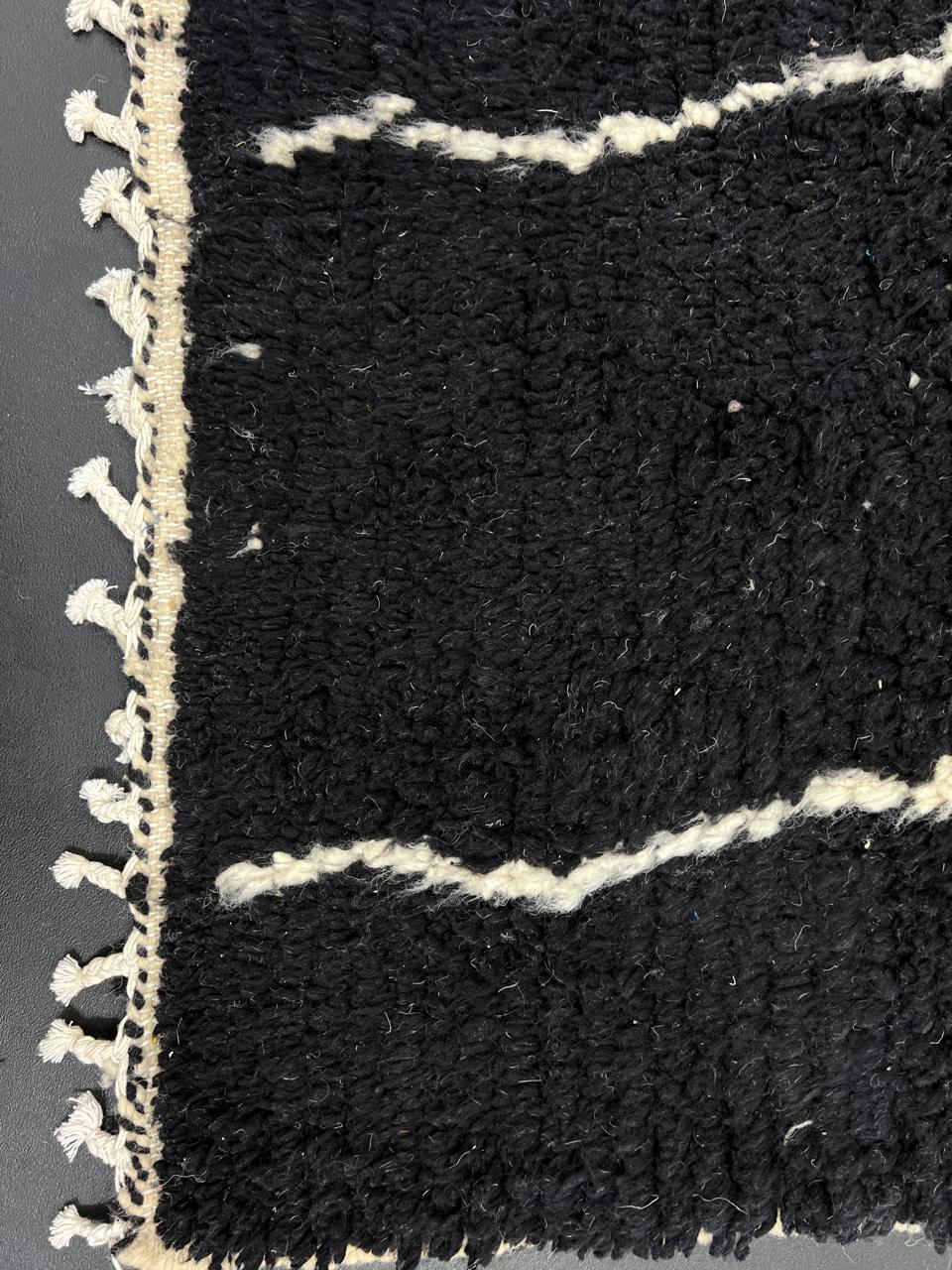 Handmade black and white Moroccan wool runner rug with abstract linear geometric design