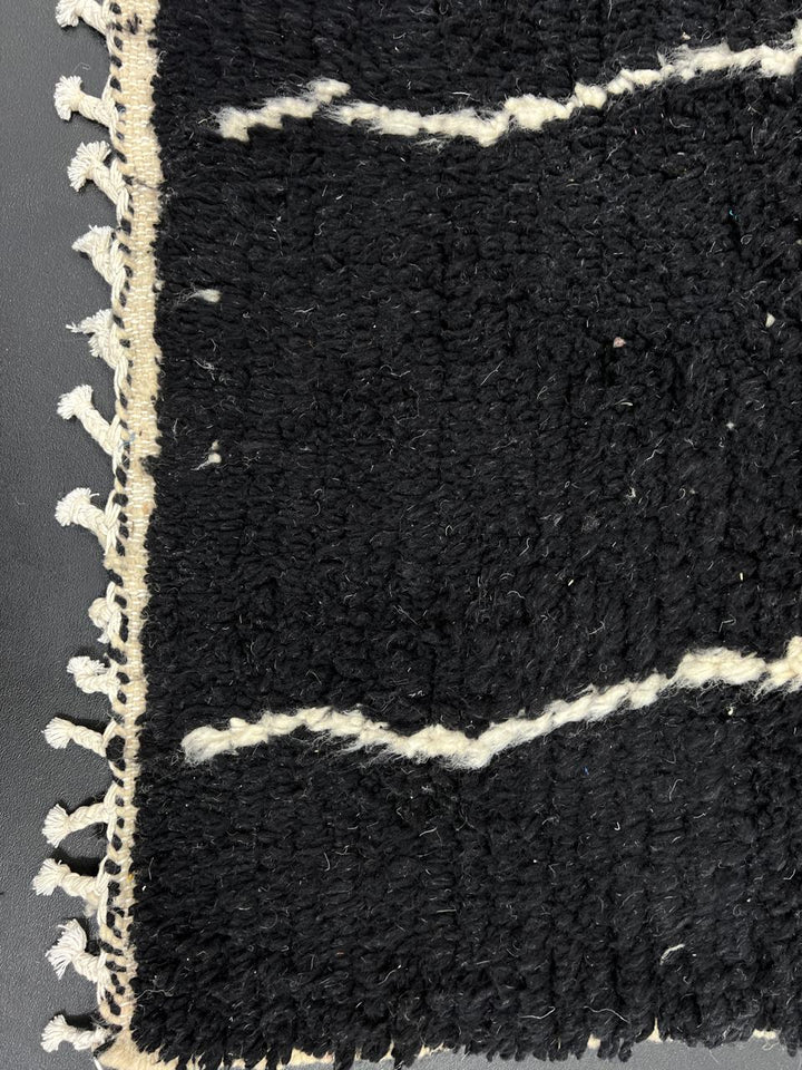 Handmade black and white Moroccan wool runner rug with abstract linear geometric design