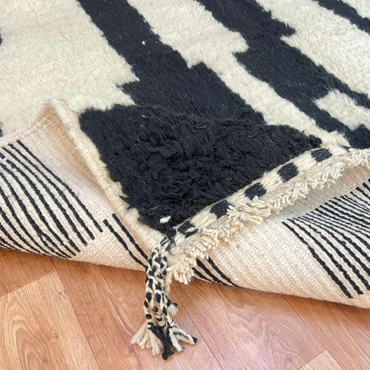 Black and white Moroccan wool runner rug with abstract Berber geometric pattern