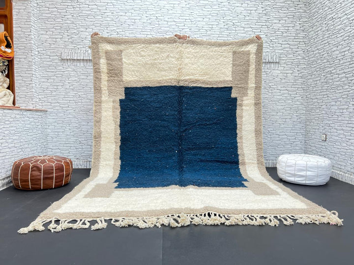 Blue beige Moroccan wool rug with deep blue geometric center