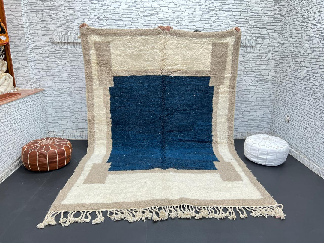Blue beige Moroccan wool rug with deep blue geometric center