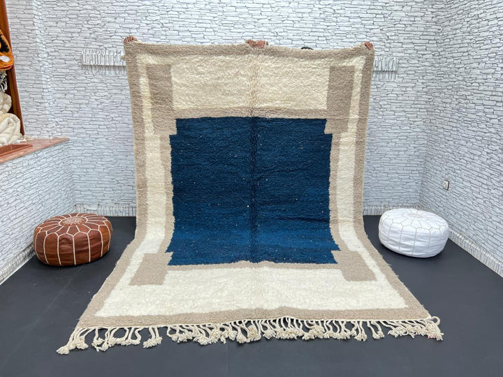 Blue beige Moroccan wool rug with deep blue geometric center