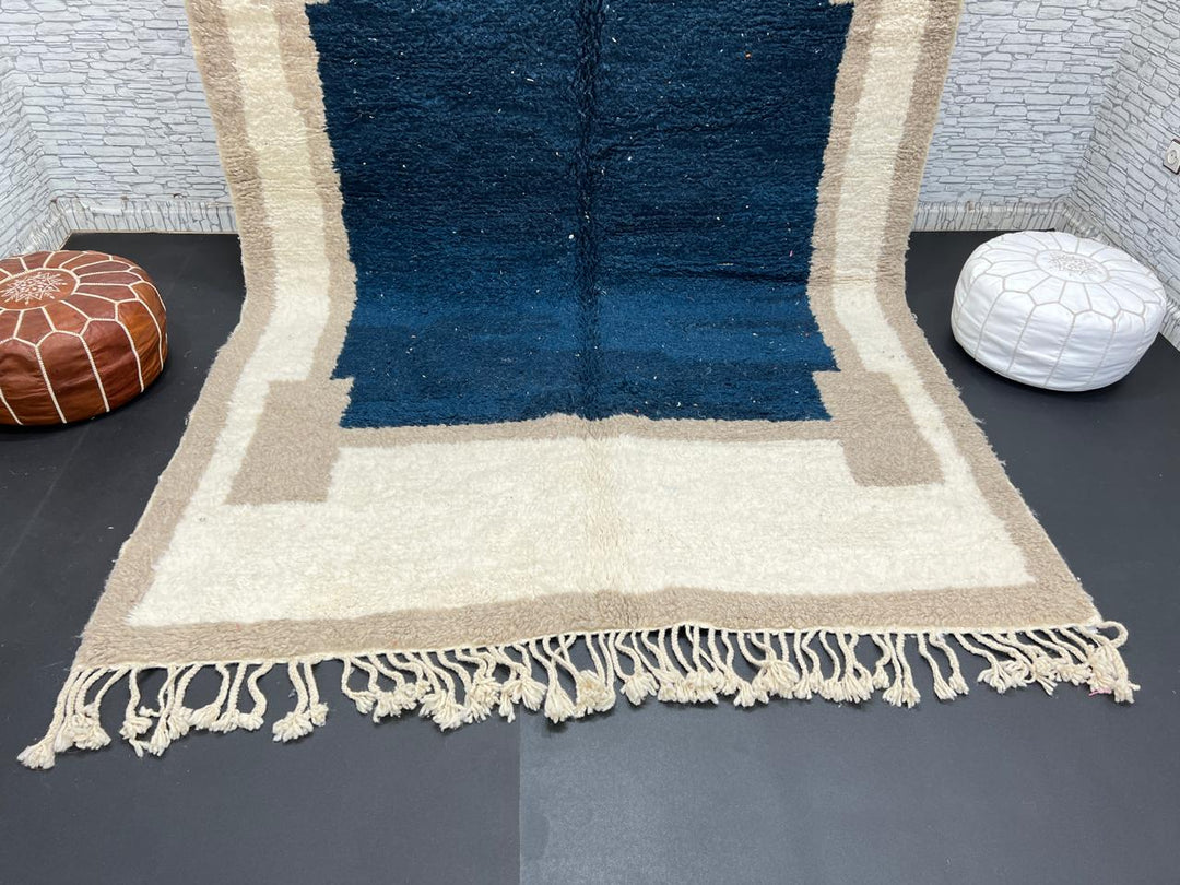 Blue beige Moroccan wool rug with deep blue geometric center