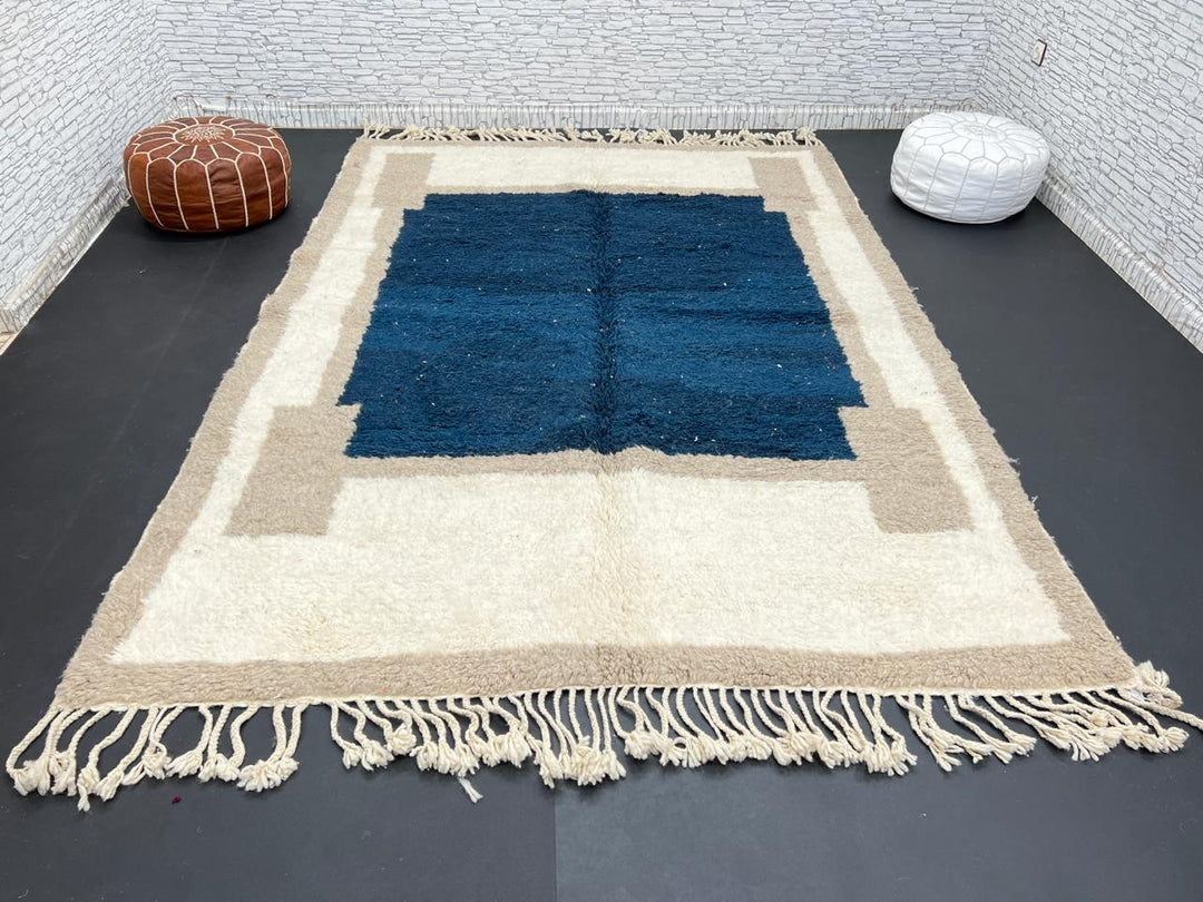 Blue beige Moroccan wool rug with deep blue geometric center