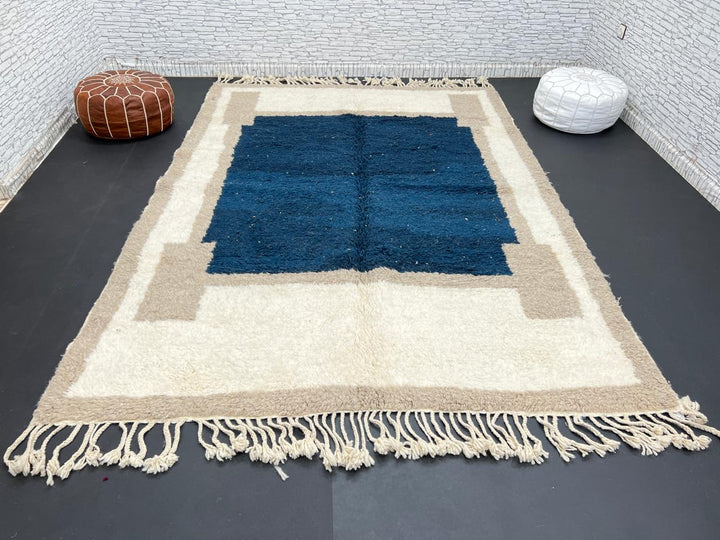 Blue beige Moroccan wool rug with deep blue geometric center
