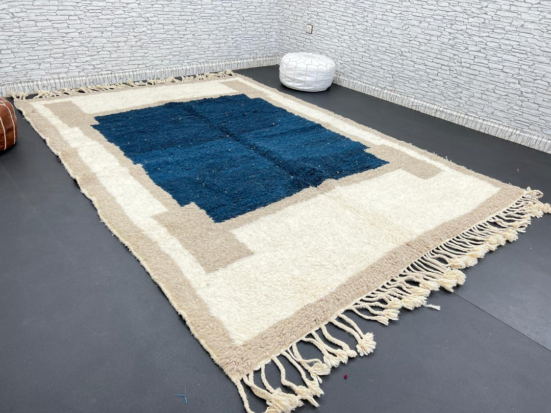 Blue beige Moroccan wool rug with deep blue geometric center