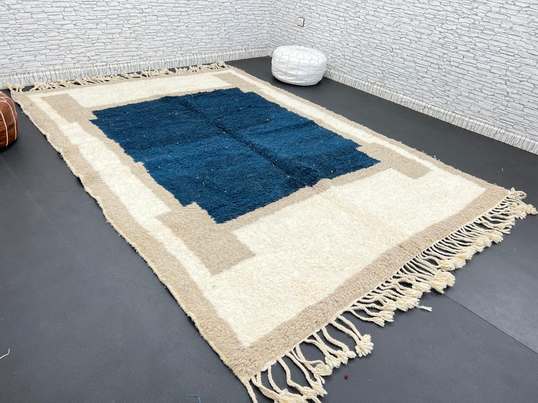 Blue beige Moroccan wool rug with deep blue geometric center