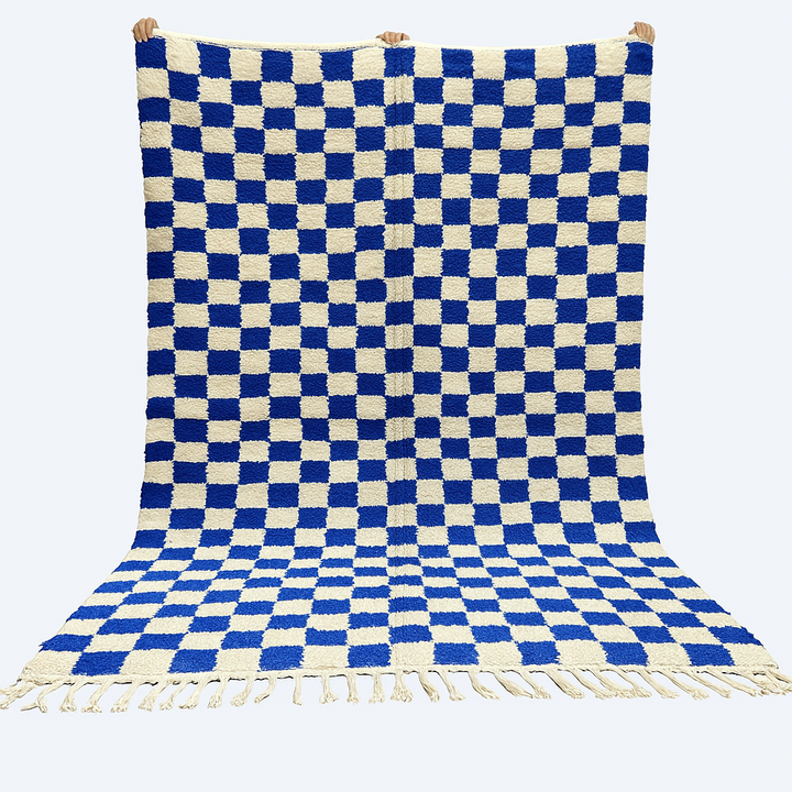 Handwoven Moroccan wool rug with blue and cream checkered design