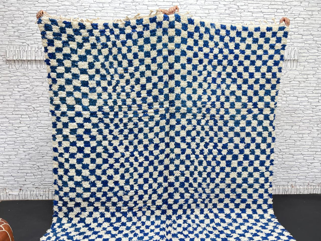 Handwoven blue and cream Moroccan wool rug with checkered design