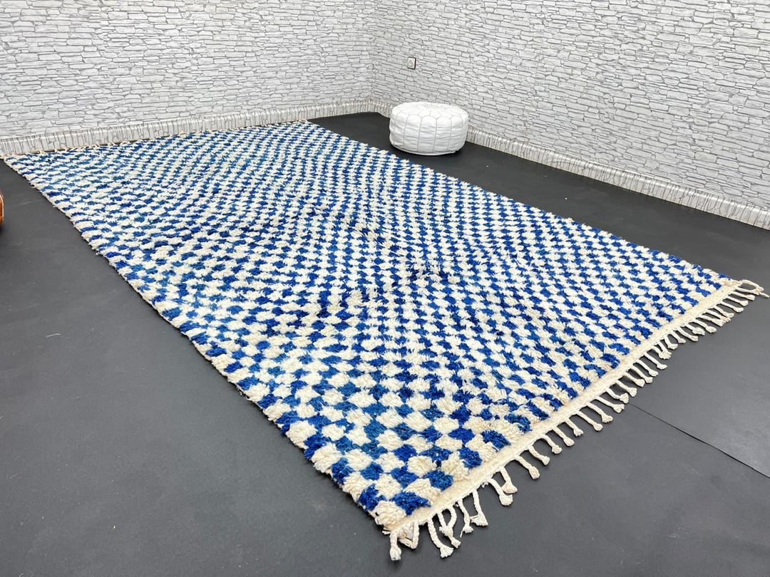 Handwoven blue and cream Moroccan wool rug with checkered design