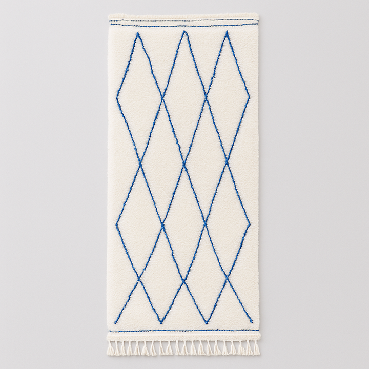 Blue diamond Moroccan runner rug made of natural wool with minimalist Berber pattern on white background and fringed edges