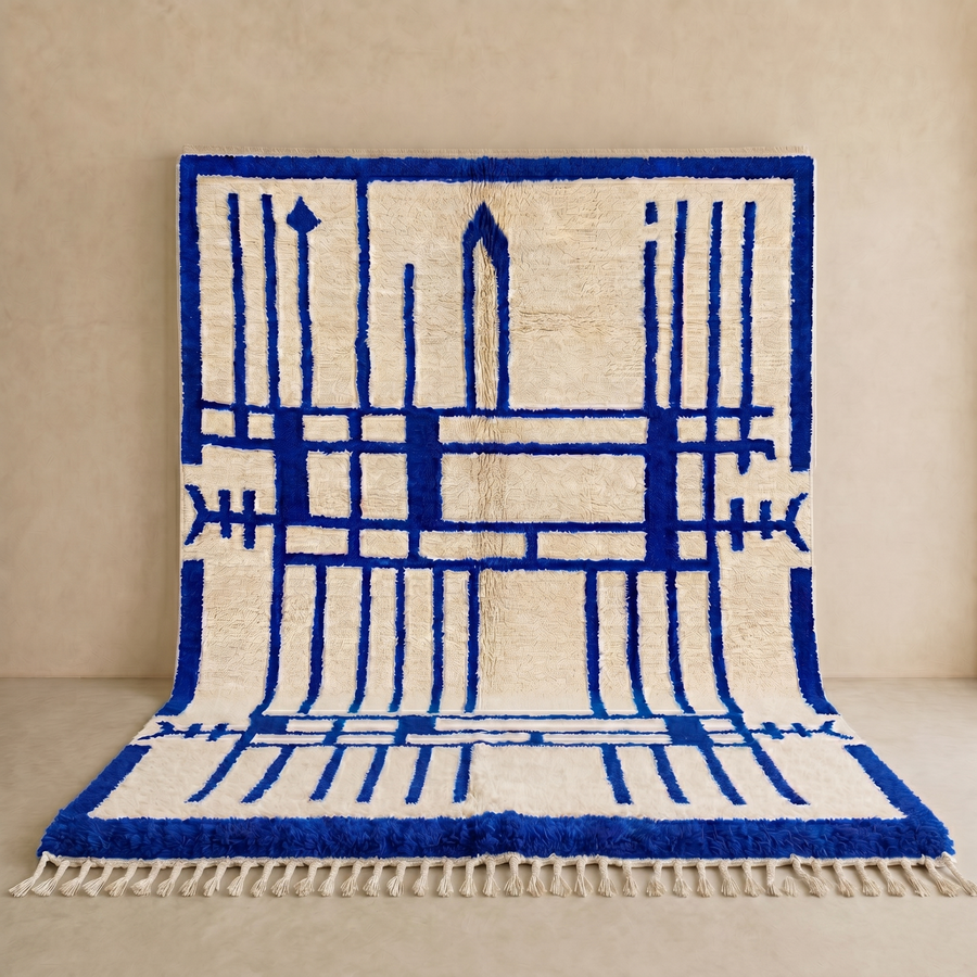 Handmade Moroccan wool rug with blue geometric Berber design. Soft plush texture, modern style, and artisan crafted.