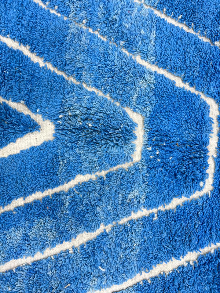 Blue Moroccan runner rug with carved ivory geometric lines, handmade wool
