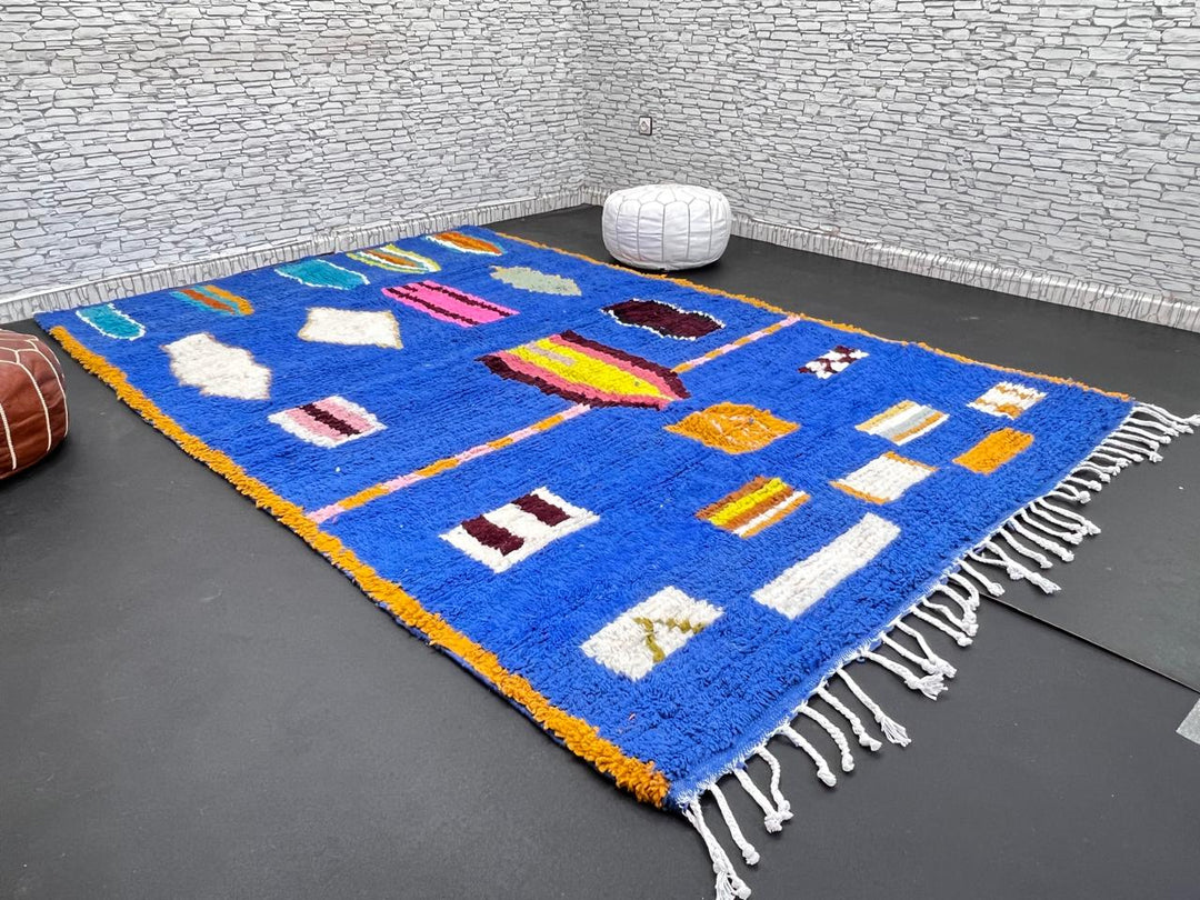 Blue Moroccan wool rug with modern abstract Berber symbols on a plush handwoven surface