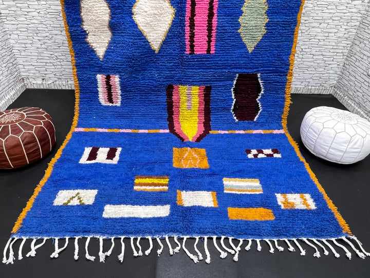 Blue Moroccan wool rug with modern abstract Berber symbols on a plush handwoven surface