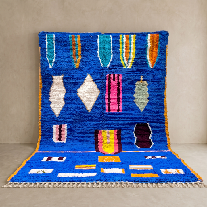 Blue Moroccan wool rug with modern abstract Berber symbols on a plush handwoven surface
