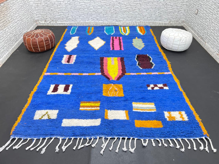 Blue Moroccan wool rug with modern abstract Berber symbols on a plush handwoven surface