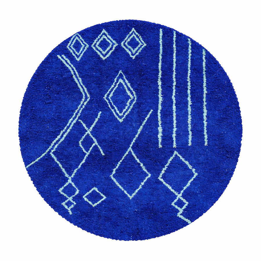 Round Moroccan wool rug in deep blue with light blue geometric Berber patterns on a white background