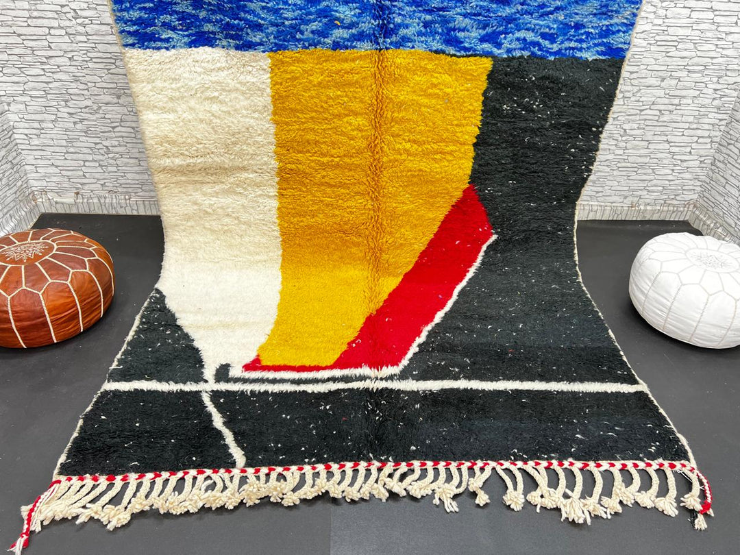 Handwoven Moroccan wool rug in blue, yellow, red, black, and white geometric pattern – modern Berber carpet handmade in Morocco