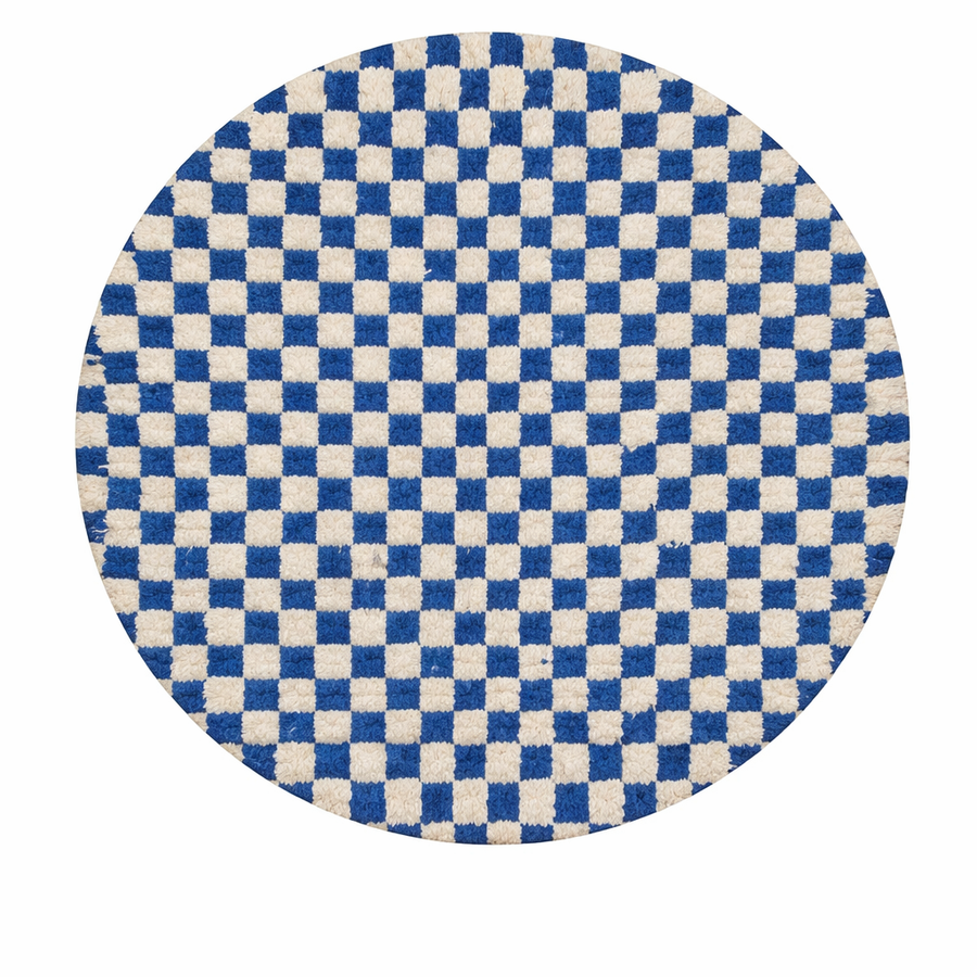 Handmade Moroccan wool rug with blue and white checkerboard pattern, round shape, and soft plush texture.