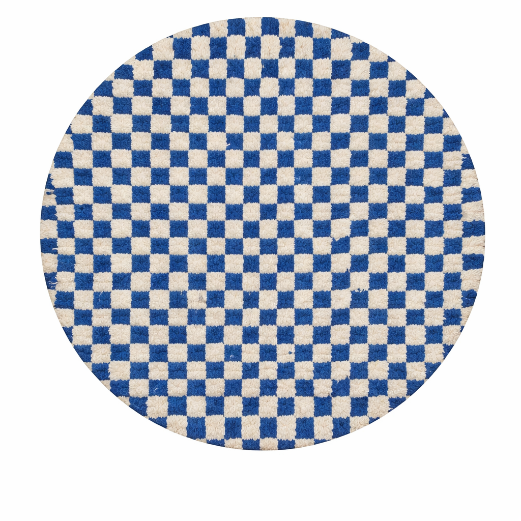 Handmade Moroccan wool rug with blue and white checkerboard pattern, round shape, and soft plush texture.