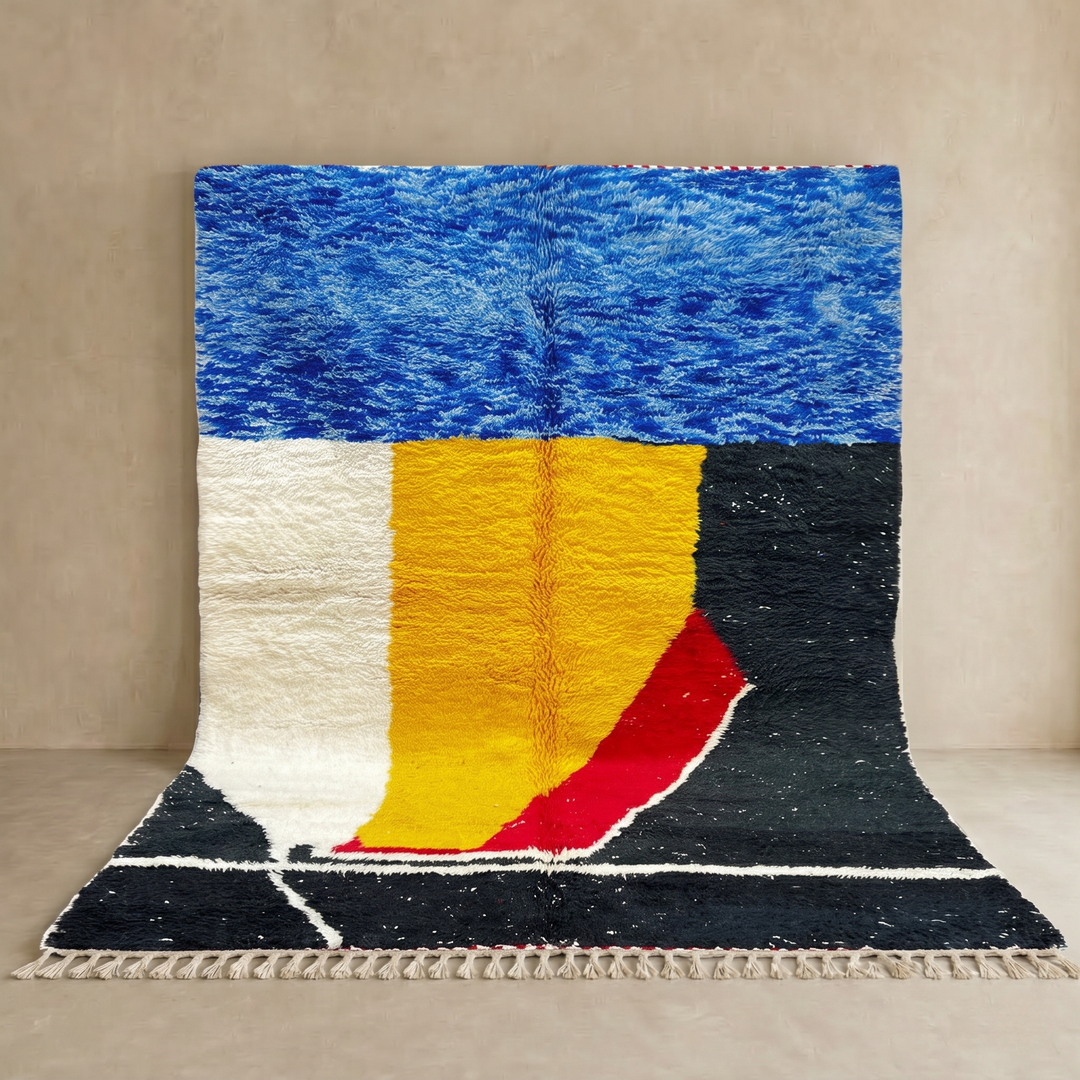 Handwoven Moroccan wool rug in blue, yellow, red, black, and white geometric pattern – modern Berber carpet handmade in Morocco