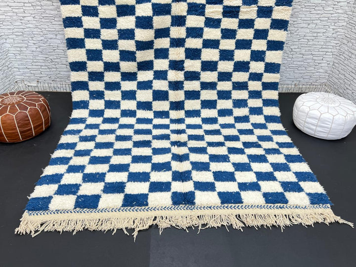 Handwoven blue and white Moroccan wool rug with checkerboard pattern