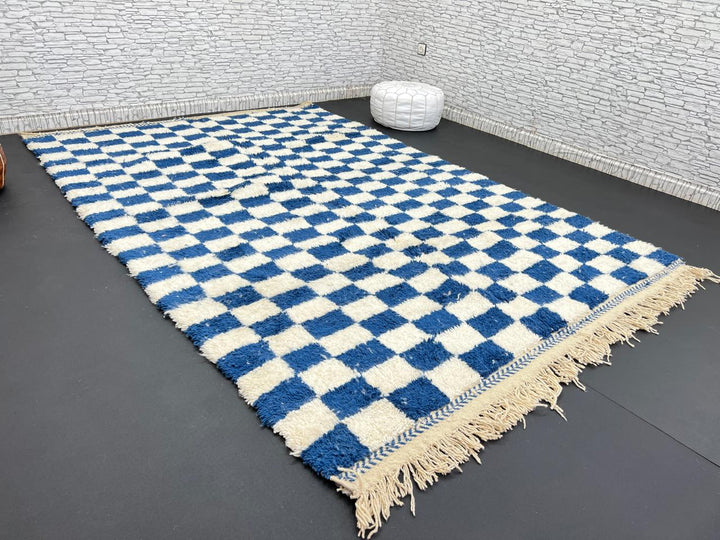 Handwoven blue and white Moroccan wool rug with checkerboard pattern
